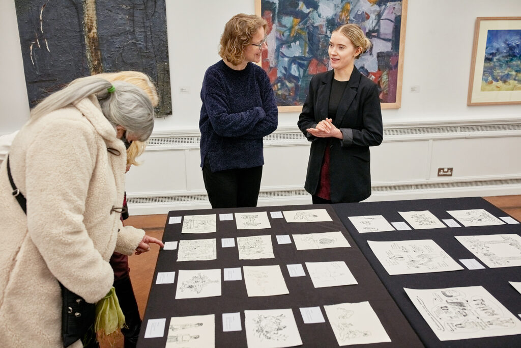 Gallery visitors and sign language interpreters with the art of Mike O'Brien, displayed in Limerick City Gallery of Art, Photo by Maurice Gunning